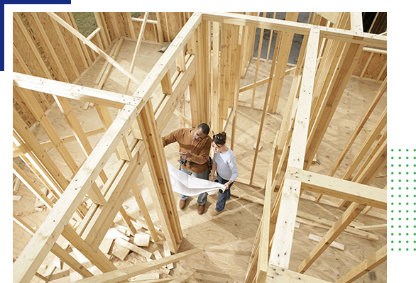 Two people in a building under construction